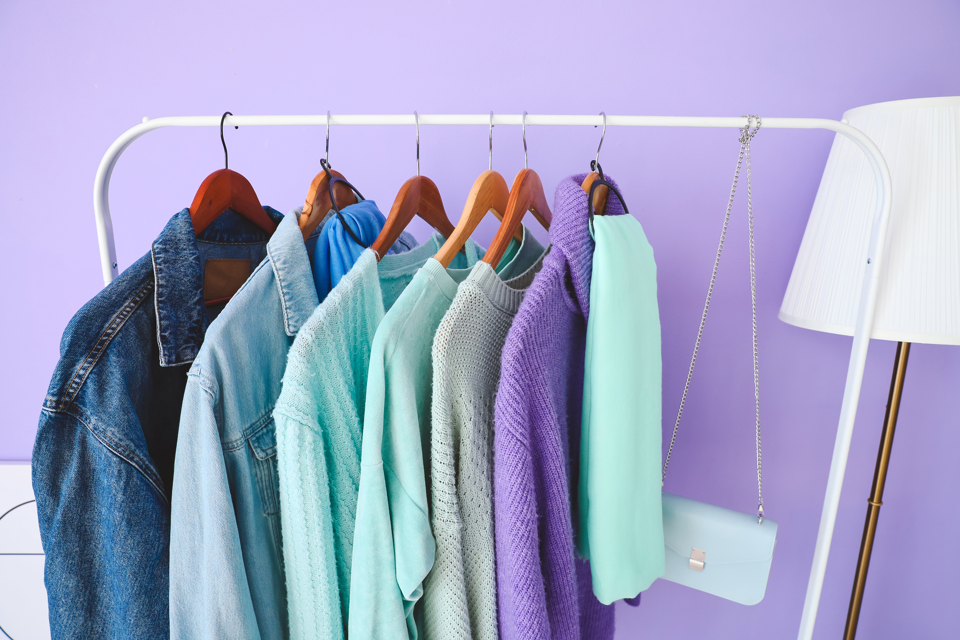 Rack with Autumn Clothes in Interior of Modern Room